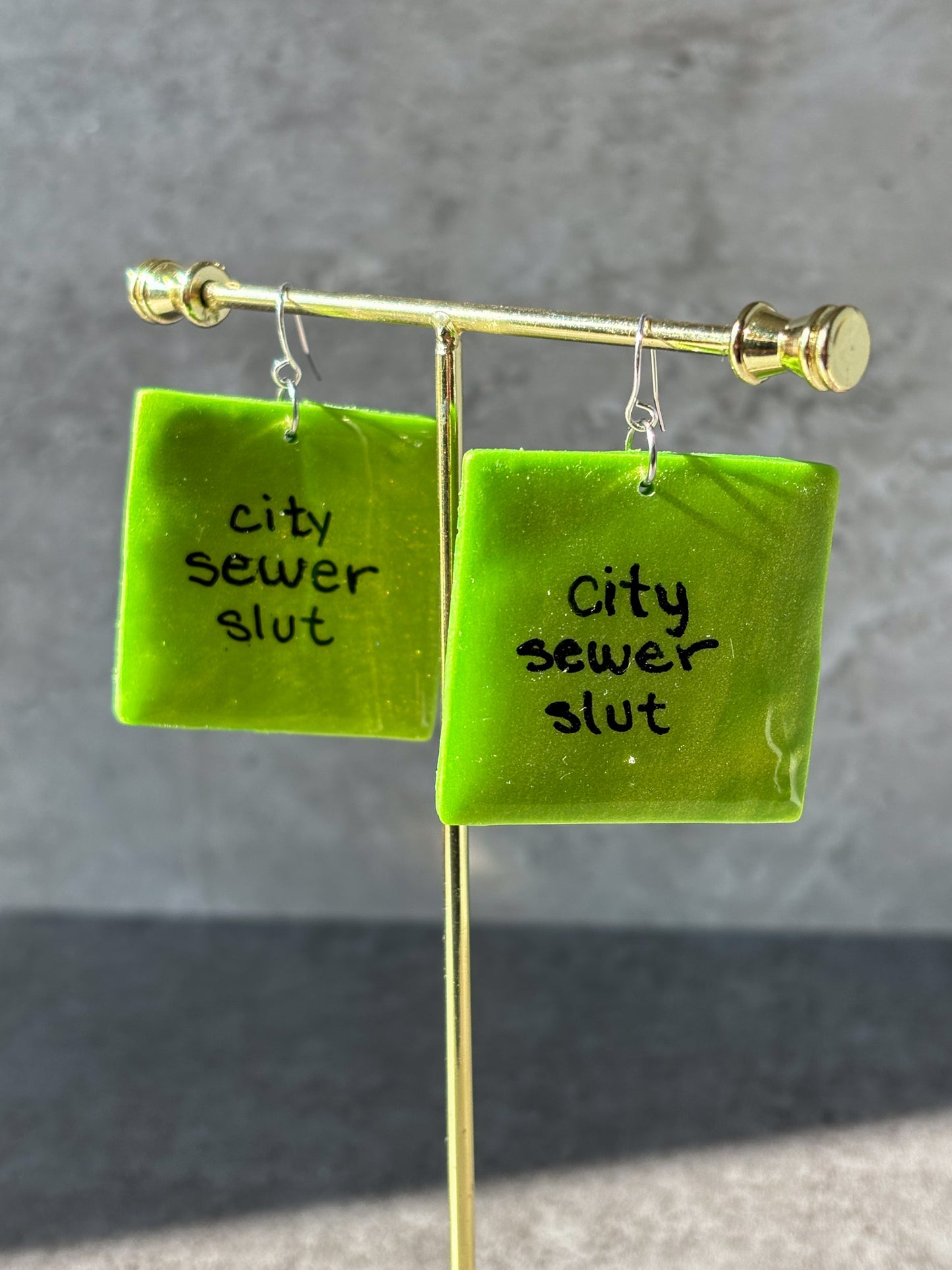 brat city sewer slut square polymer clay earrings