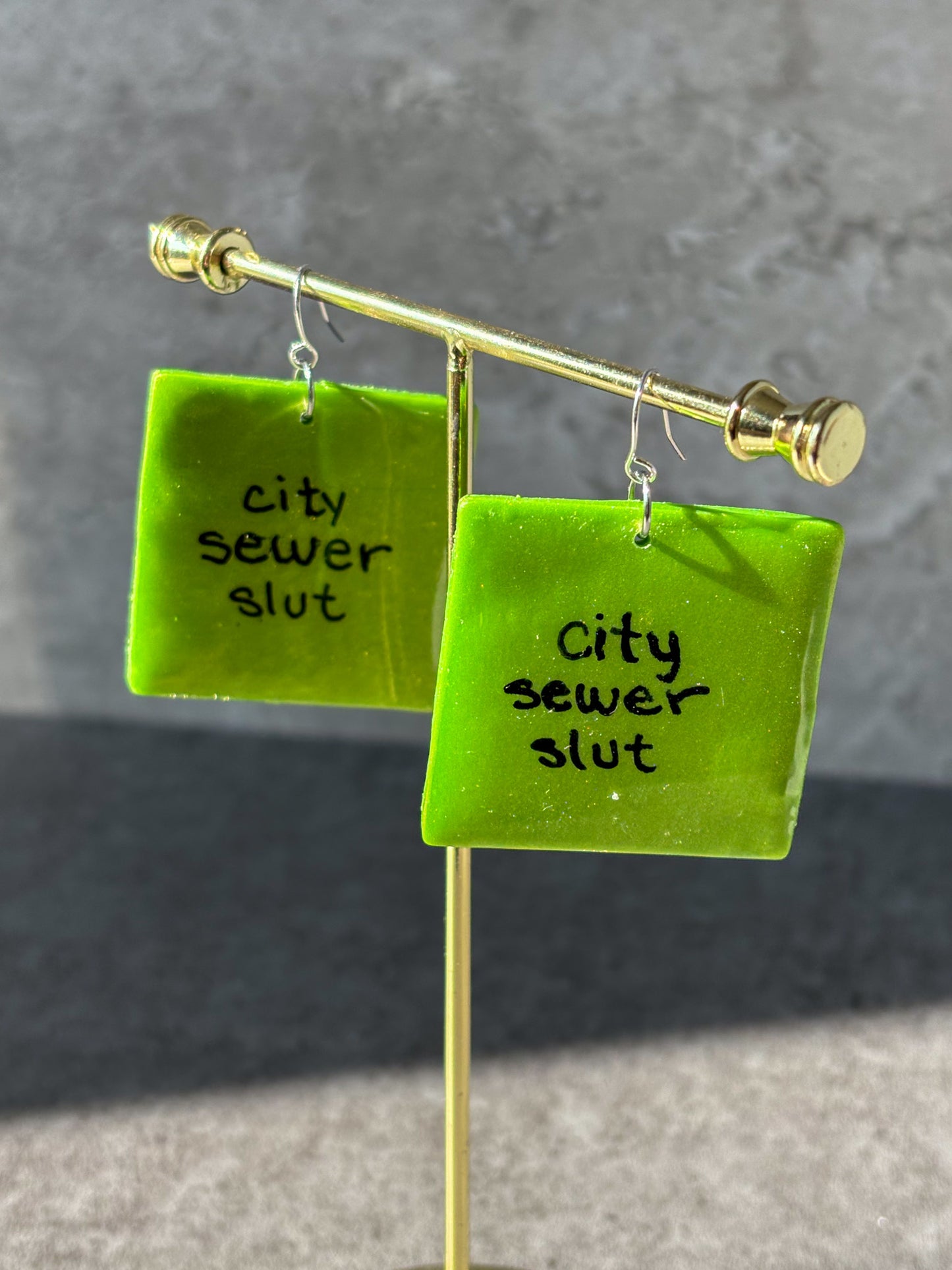 brat city sewer slut square polymer clay earrings
