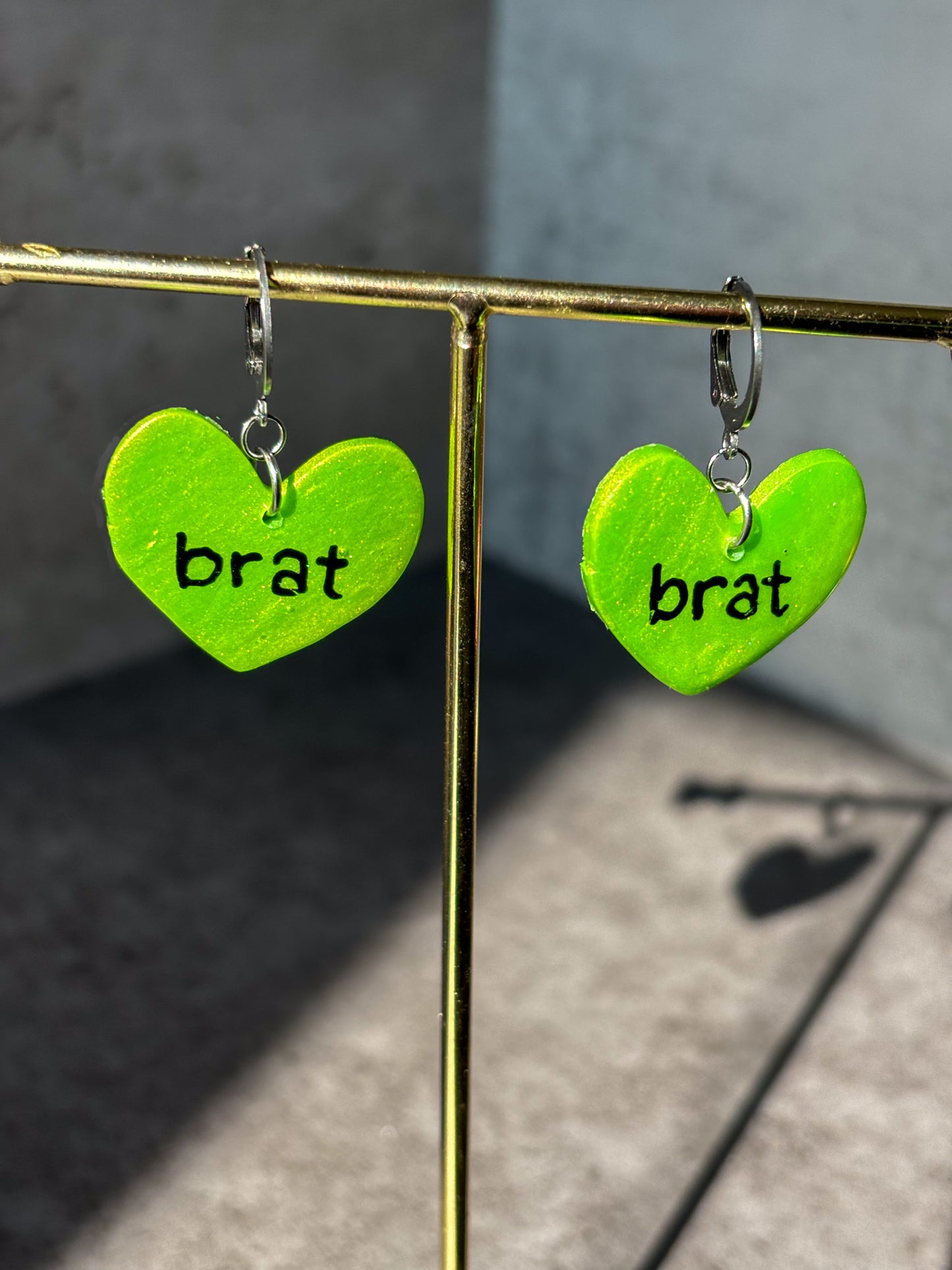 brat green heart earrings
