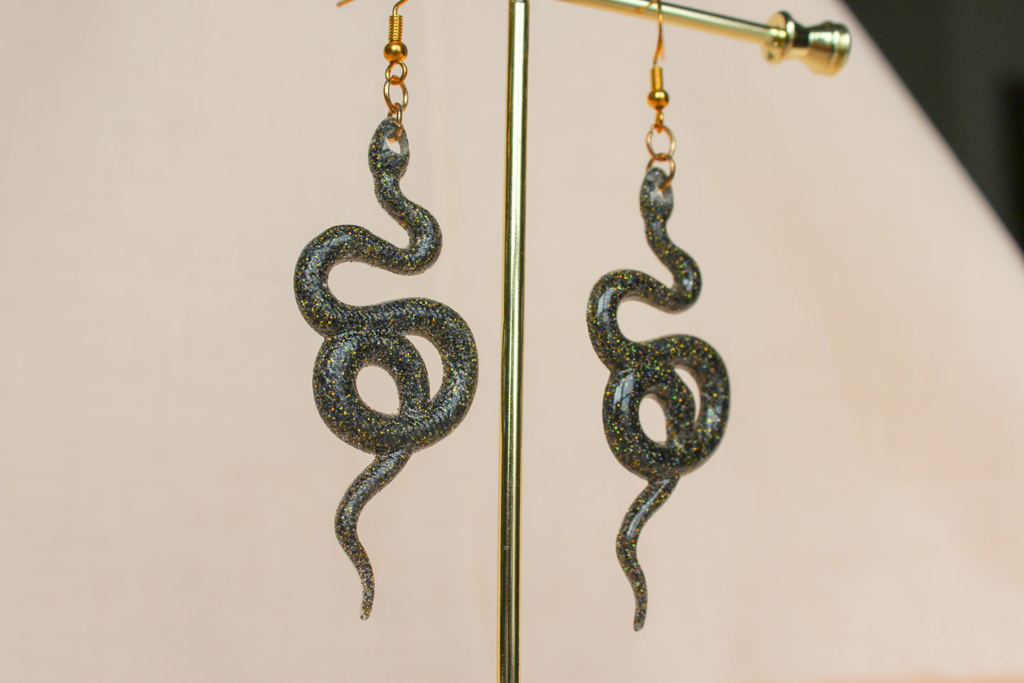Black Sparkle Resin Snake Twist Slither Dangle Earrings